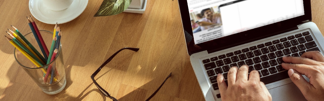 A person using computer; image used for HSBC foreign exchange rates page.